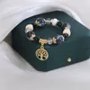 2023 Las últimas pulseras colgantes de forma exquisita creadas para dama Pulsera de cuentas de cerámica Pulsera de árbol de vida Pulsera creativa de moda de piedra natural de Amazon