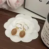 Pendientes Pendiente de gota de diseñador Regalos de amor de viaje chapados en oro de lujo Pendientes colgantes Diseño Encanto para mujeres Pendientes de acero inoxidable de alta calidad No se desvanecen