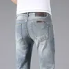 Summer Mens Jeans Edition Small Foot Elastic Slim Fit Haut de gamme Marque Leather Label Men Pants