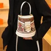 Factory wholesale ladies shoulder bags 2 colors street popular totem bucket bag trend western-style printed handbag thickened leather mobile phone coin purse 2210