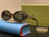 Gafas de sol de lujo, placa de ojo de gato de diseñador femenino, gafas de doble capa, hip hop masculino, gafas de sol resistentes a los rayos UV 6053