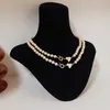 Saturn Pearl Heart nceklace Женщина роскошная дизайнер -дизайнерские дровки 14 тыс. Желто -золото, покрытая цепью Love Hearts Vvs Подвесные ожерелья