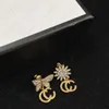 Charm Sunflower and butterfly Earring metal twist shape Alphabet pendant, personality left ear and right ear irregularity super beautiful lady earrings, gifts