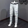 Jeans Masculino High Street Moda Masculino Retrô Azul Claro Pintado Elástico Magro Rasgado Contas Remendadas Calças de Marca de Hip Hop