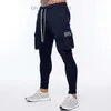 Herrbyxor Autumn New Men's Jogging Pants Cotton Pocket Design Running Freight Pants Gym Men's Fitness Multi Pocket Style Training Set Z230731