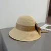 Kvinnors lyxiga solskydd och andas designer Straw Hat Autumn and Summer Vacation Travel Dating Satin Bowknot Ribbon Bucket Hat