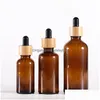 Packing Bottles 15Ml 20Ml 30Ml 50Ml 100Ml Dropper Bottle Amber Glass With Bamboo Lids Essential Oils Sample Vials Drop Delivery Office Otlcs