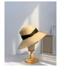 Cappelli a tesa larga 202304-2509023 Summer Drop Beach Paglia fatta a mano Nastro arancione Holiday Paper Lady Sun Cap Cappello per il tempo libero da donna