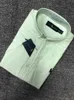 男性の夏の縞模様の袖ポールコットンシンオックスフォードテキスタイルカジュアルビジネスメンズユースショートシャツ