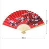 Produtos de estilo chinês 50cm estilo chinês grande ventilador dobrável vermelho usado para decoração de parede de casamento família sala de estar plano de fundo ventilador de papel série artesanal