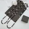 Colliers de pendentif marque de concepteur de luxe Double lettre colliers pendentifs 18k Pull à perle plaqué Collier en acier inoxydable Femme Wedding juif Y2404293JI2