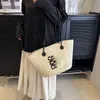 Trendige Damen-Tragetaschen, stilvolle Strohhandtasche, gesticktes Logo, Strohkorb, gewebte Strandtasche