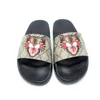 Женщины мужчины G Slippers Ladies Плоская платформа сандалии резины для мужчин Женщины скользят цветочные бакадные днищики шлепанцы пчелиные пляж.