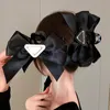 Simple créateur de mode Triangle pince à cheveux marque lettre femmes fille cheveux griffe cheveux bijoux chapeaux épingle à cheveux pince à cheveux accessoires
