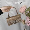 Złoty błyszczący niedoskonały diament Bowknot Embedding Mała kwadratowa torba obiadowa Pearl Mobile Telefon Bag ręczna torba na crossbody Bag Girl 230401