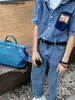 Bolsa de designer 50cm 2024 nova bagagem de viagem para homens e mulheres grande capacidade 50 litchi padrão bolsa aeroporto tem log