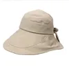 Cappelli a tesa larga Cappello estivo da donna Cappello da sole Visiera Protezione UV Fiocco da spiaggia Cappello pieghevole da donna giallo a secchiello
