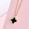 New Classic Van clover necklace designer four-leaf clover necklace Korean version simple colorless titanium chain double-sided two-color black shell pendant