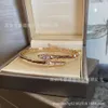 Desginer S Baojia Edition Snake Armband Ny fulllätt guldplätering mångsidig huvud och svans diamant hög elasticitet