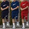 Sommar mode män och kvinnors shorts träningssatser kort ärm 100% bomullsgrå t -skjorta shorts tryck man set mäns märke kläder 2 stycken uppsättningar