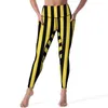 Leggings femininas listrado vertical sexy preto e amarelo ginásio yoga calças de cintura alta estiramento esportes collants com bolsos bonito leggins personalizados