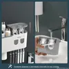 Toothbrush Holders MENGNI Magnetic Adsorption Inverted Holder Wall Automatic Toothpaste Squeezer Storage Rack Bathroom Accessories 231101