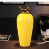 زجاجات التخزين الحديثة البسيطة الصفراء السيراميك مع غطاء غرفة المعيشة سطح المكتب الحرف اليدوية للمنزل ترتيب ترتيب زهرة