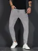 Męskie dżinsy mężczyźni rozciągają chude dżinsowe spodnie solidny kolor czarny niebieski jesienny lato luksusowy ulica harajuku hip-hop w stylu Slim Fit Spoders