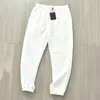 Pantalones de chándal casuales para hombre Hip Hop para mujer letra impresa masculina suelta lujo cómodo todo fósforo waffle moda diseño de calle cómodo joggers vinculantes pantalones de chándal