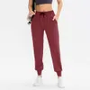 LL-01 Pantalon d'entraînement Pantalon pour femme Tenue de yoga Pantalon ample Neuvième pantalon Excerise Sport Gym Course Casual Pantalon long à bandes à la cheville Élastique Taille haute Cordon de serrage