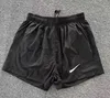 Playa Verano Pantalones cortos para hombres Pantalones cortos para mujeres Moda Correr Deporte Suelto Proceso de lavado de secado rápido de tela pura Moda Casual Tamaño S-3XL