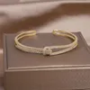 Bangle 14K real gold plating exquisite AAA luxury full zircon knot bracelet elegant women s wedding party opening adjustable 231101