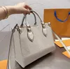 ONTHEGO LUXURY TOTES DESIGNER BAG WOMENS ON THE GO MMハンドバッグトートバッグホットクロスボディフラワーレディースカジュアル本革の財布のショルダーバッグ