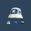 Hüte mit breiter Krempe, handgefertigte gehäkelte Blumen-Eimermütze für Mädchen, koreanische Reise, Strand, Panama-Kappen, Design, Strickmütze, Wintermütze, Wolle, warme Mütze 231102