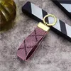 Hombres Mujeres Keychains Lanyards Diseñador Flower Cuero Bag Bag Key Lanyard Classic Keychain Fashion Colgante