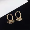 New designed TRIOMPHE Arch hollow out Hoops EARRINGS IN BRASS WITH GOLD SHINY WOMEN EAR HOOPS Designer Jewelry CE LINEmnb555