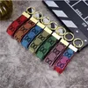 Hombres Mujeres Keychains Lanyards Diseñador Flower Cuero Bag Bag Key Lanyard Classic Keychain Fashion Colgante