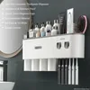 Toothbrush Holders MENGNI Magnetic Adsorption Inverted Holder Wall Automatic Toothpaste Squeezer Storage Rack Bathroom Accessories 231101