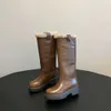 Miui Famille de chaussures pour femmes de meilleure qualité Bottes hautes épaisses 2024 Nouveau talon épais Tête ronde Longueur du genou chaud Bottes longues épaisses