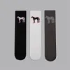 Koreansk trendtecknad tryckta strumpor Welldone American Trend Sports Tube Socks Cotton Men and Women