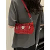 Sacs à bandoulière Sacs à main Sac à bandoulière en cuir verni pour l'été des femmes nouveau sac à main à serrure coeur entièrement en pierre 2023stylishyslbags