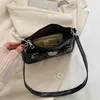 Sacs à bandoulière Sacs à main Sac à bandoulière en cuir verni pour l'été des femmes nouveau sac à main à serrure coeur entièrement en pierre 2023stylishyslbags