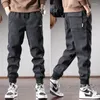 Pantalon pour hommes Automne Black Stripe Hommes Streetwear Casual Baggy Harem Broderie Sports Taille élastique Cordon de serrage Pantalon de jogging