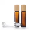 1/2 oz rolo de vidro cosmético de vidro em garrafas âmbar embalagem de perfume fosco transparente com bola de metal e tampa de bambu