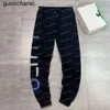 2023SS Męskie spodnie jesień mężczyźni odzież sportowa Casual Tracksuit Fashion Mash Mandpants Spodnie Black White Designer Jogger Mens Pants