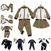 Printemps et automne nouveaux costumes de sport de créateurs d'épissage de lettres pour enfants pour hommes et femmes enfants manches longues et pantalons loisirs vêtements pour enfants en plein air A003