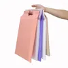 Envoltura de regalo 30x40 cm Bolsas de entrega Bolsa de polietileno de color con asa Sobre de mensajería portátil Bolsa de plástico gruesa 100 piezas