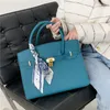 Bolsas de ombro femininas por atacado de fábrica 2 elegantes bolsas clássicas de lichia doce pequena bolsa de fita de arco fresco este ano popular bolsa de couro de cor sólida 9988 #