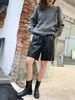 Kvinnors shorts koreanska svart läder knälång shorts för kvinnor med fickor hög midja lösa breda ben långa kvinnors shorts faux pu läder 230403