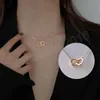 Collier ras du cou double coeur plaqué or 18 carats en acier inoxydable pour femme